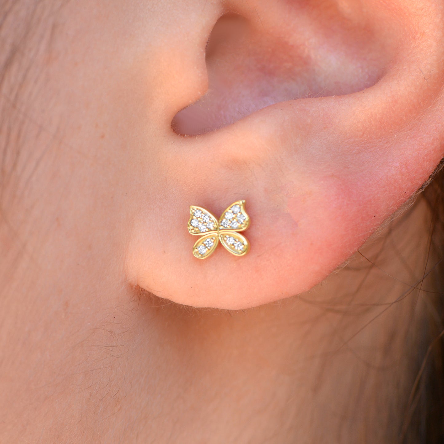 Diamond Butterfly Stud Earrings on ear