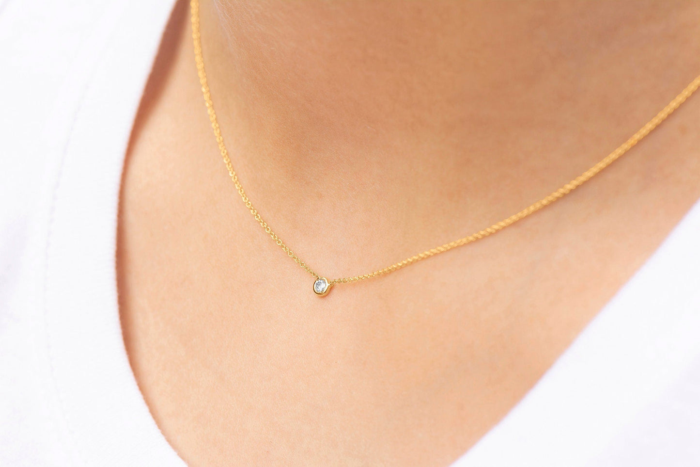 Women wearing a 14k Rose Gold Bezel Set Diamond Pendant with Cable Link Chain  .05ct.